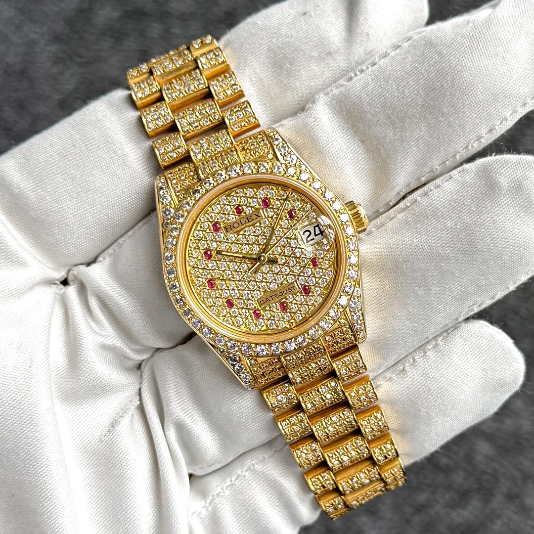 Rolex Datejust 68278 18K yellow gold, full pave diamond dial with natural ruby indices, front view.